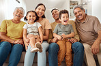 Happy, big family and portrait smile on sofa in happiness for relationship, quality bonding and time together at home. Parents, grandparents and kids smiling for relaxing family on living room couch