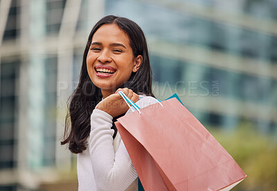 Buy stock photo Shopping, retail and city with a woman customer carrying bags while on the search for a sale, bargain or discount. Money, gift and store with a female shopper outdoor at a street mall for consumerism