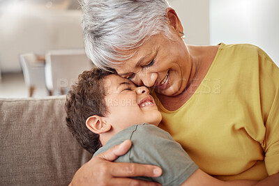 Buy stock photo Happy family, child and grandma hug and bond in living room together, happy and content in their home. Relax, smile and love of boy hugging senior woman showing love and having fun in brazil house
