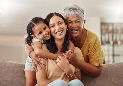 Buy stock photo Grandmother, mom and child hug in a portrait for mothers day on a house sofa as a happy family in Colombia. Smile, mama and elderly woman love hugging young girl or kid and enjoying quality time 
