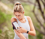 Phone, fitness and exercise with a sports woman tracking her progress on a mobile app for health while training. Running, smartphone and workout with a female athlete or runner exercising for cardio