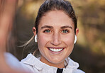 Earphones, face or woman in fitness selfie, training or workout in nature environment, forest woods or garden park. Zoom, portrait or happy smile for runner in sports influencer photograph with music