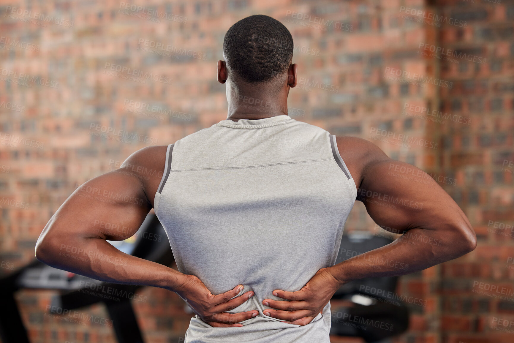 Buy stock photo Back pain, fitness and exercise with a sports man suffering from an injury or inflammation during a workout in the gym. Training, health and anatomy with a male athlete struggling with muscle strain