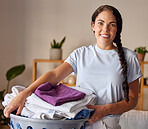 Laundry, cleaning and portrait of woman with basket with clothes, housekeeping and lifestyle in living room. Smile, routine and fabric towel with girl helping with chores, housewife and hygiene 