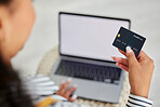 Credit card, laptop and woman doing online shopping, banking and online payment from her house. Ecommerce, retail and person reading information on a debit card to pay a store on the web with tech