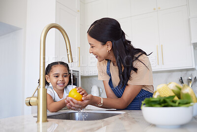 Buy stock photo Vegetable, family and washing with a girl and mother cleaning a pepper in the kitchen of the home together for hygiene. Kids, health and cooking with a woman and daughter using a basin to rinse food