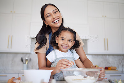 Buy stock photo Mother, baking and bonding of a girl with mama learning in a home kitchen with a smile. Portrait of a happy black mom with cooking, love and care holding her kid in a house together smiling