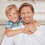 Family, love and portrait of father with son sitting on the sofa, smile of faces. Happiness, affection and child bonding with single dad in family home hugging, embrace and relax together on couch