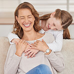 Mom, happy and smile while girl behind sofa in living room for bonding, care and love in house. Mother, child and happiness in lounge at couch for laughing, together or hug in family home for embrace