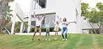 Family home, real estate and celebrate of people happy about new property outdoor. Jumping children, mother and man with happiness and excited energy experience of kids with a smile on grass 