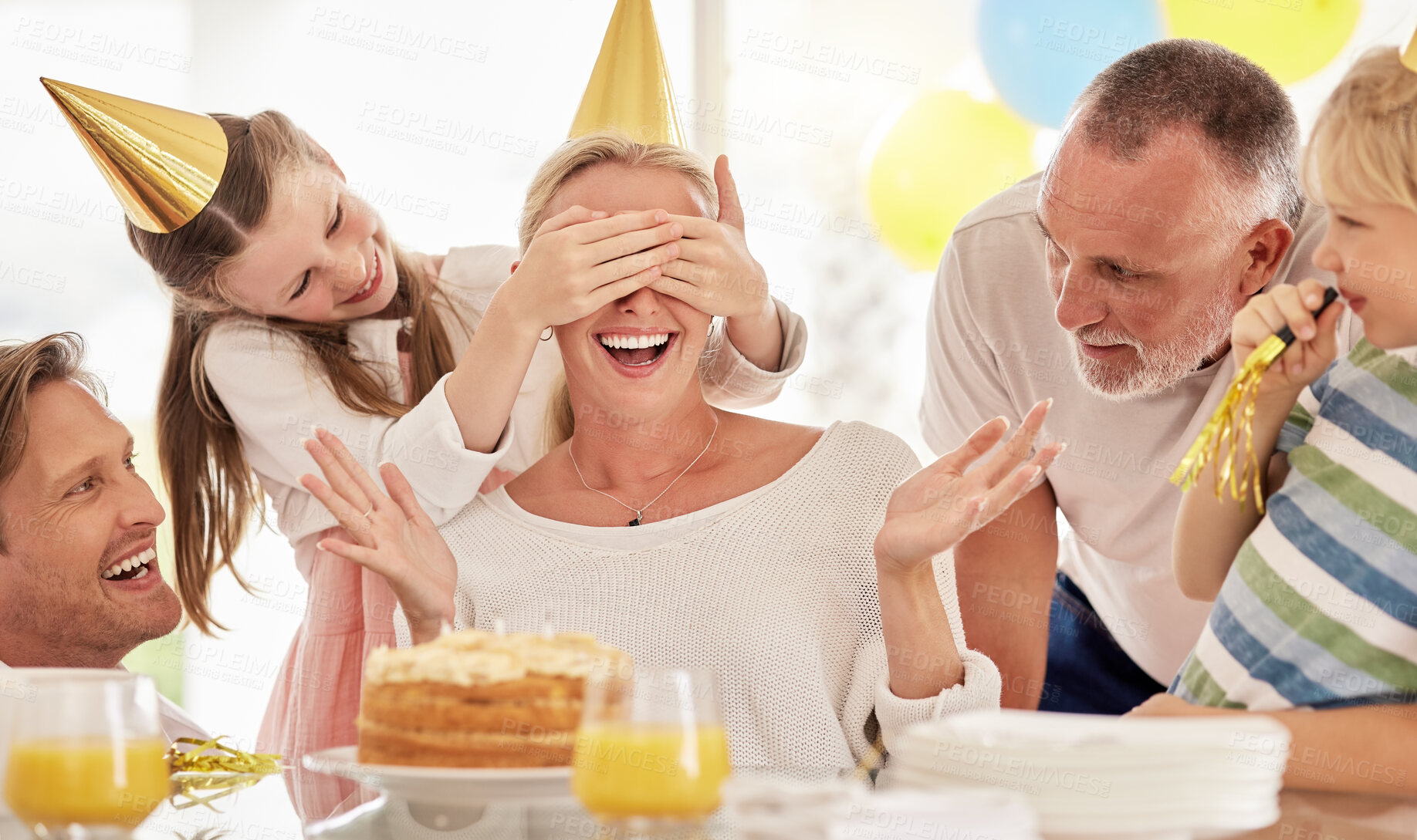 Buy stock photo Surprise, birthday cake and mother with family for celebration, party and excited people. Happiness, love and big family with children cover mom eyes to celebrate mothers day holiday together