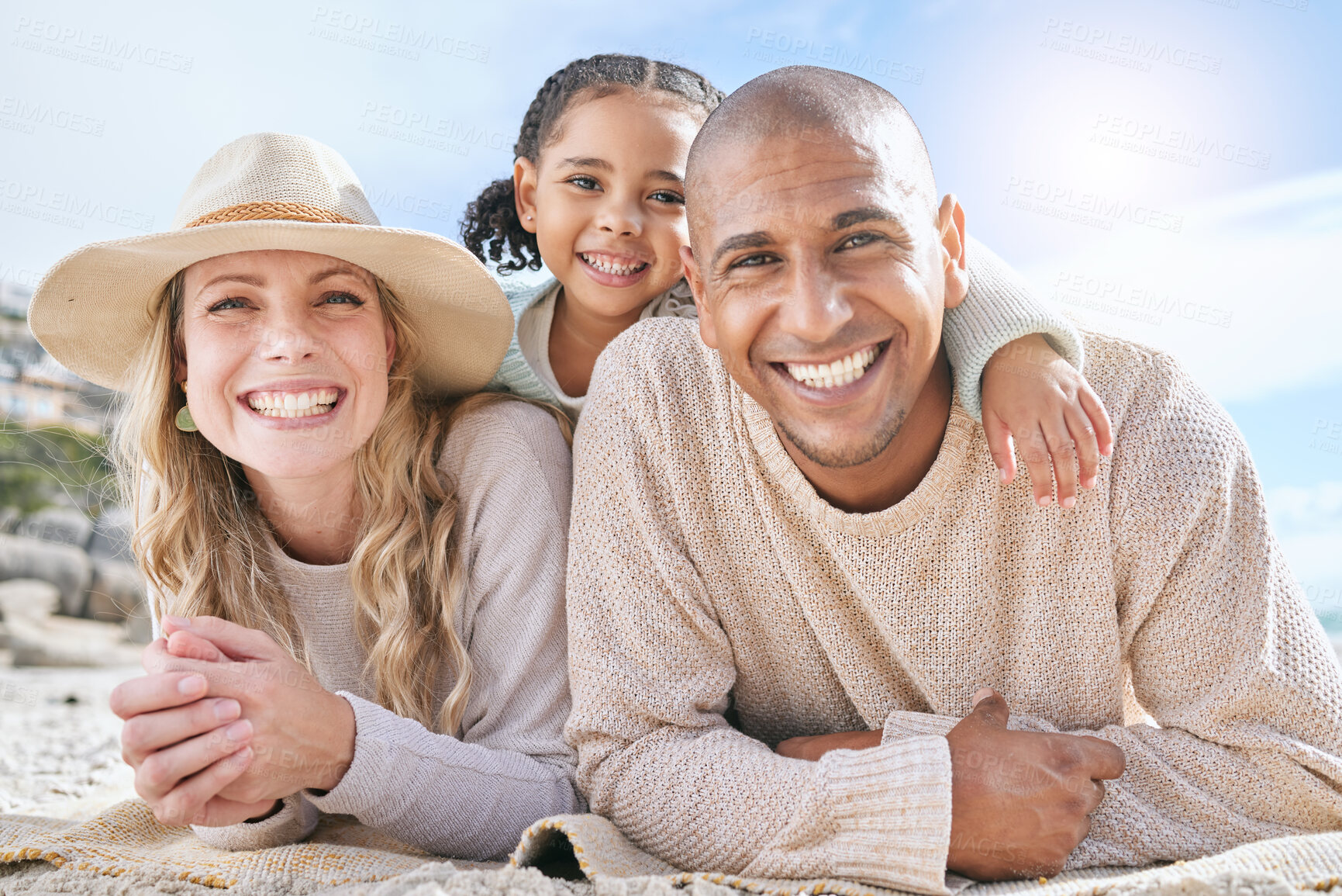 Buy stock photo Diversity, happy family and travel vacation relax together bonding on beach. Portrait of mother, father and child happiness smile, calm and outdoor summer sunshine on ocean sand holiday lifestyle