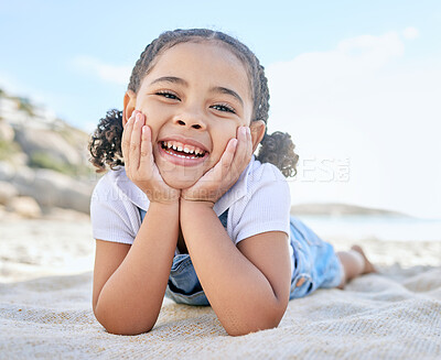 Buy stock photo Child, smile and happiness on beach vacation picnic in summer with a face portrait for smile, fun and summer travel. Girl kid lying in sun on holiday, adventure and playing by the ocean in Florida
