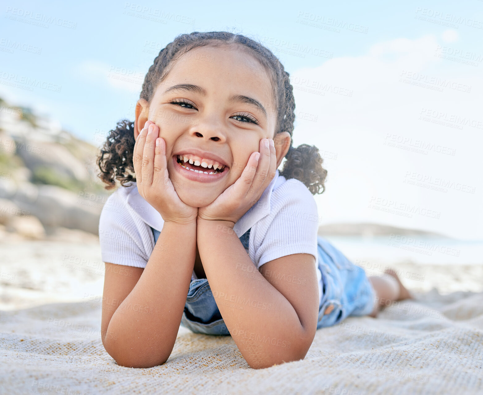 Buy stock photo Child, smile and happiness on beach vacation picnic in summer with a face portrait for smile, fun and summer travel. Girl kid lying in sun on holiday, adventure and playing by the ocean in Florida