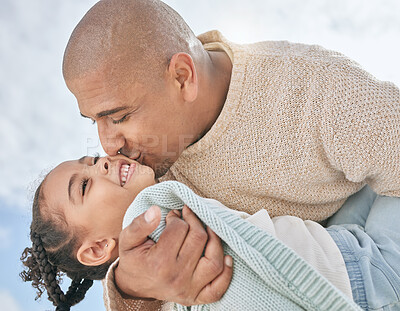 Buy stock photo Love, sky and father kiss kid while having fun, play and enjoy outdoor quality time together for peace, freedom and bond. Black family happiness, clouds and child care for happy youth girl with dad