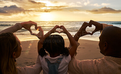 Buy stock photo Beach, heart hands and family for love of summer, ocean and outdoor wellness with parents, child and sunset sky clouds . Behind of people, or mother and father with kid with care sign or icon for sea