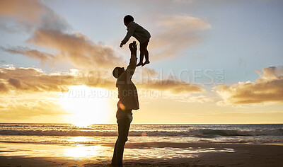 Buy stock photo Father, child and air for lift at beach, sunset and waves on horizon for playing, fun and bonding. Dad, kid and sky after throw, hands and game with silhouette for happiness, parenting and love