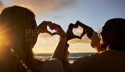 Buy stock photo Heart hands, love and couple on beach for summer, outdoor health and wellness with sunset sky and silhouette. Happy woman or people with care sign for ocean, sea holiday or vacation together