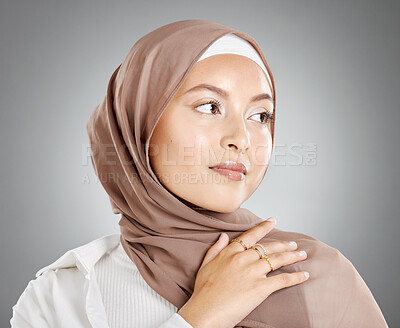 Buy stock photo Hijab woman, beauty and skincare for arab muslim female wearing a scarf, makeup and cosmetics on grey studio background. Islam, fashion and skin care with trendy Muslimah wearing ring accessories 
