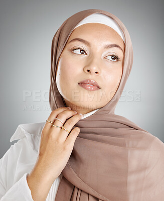 Buy stock photo Skincare, makeup and Islamic woman with an hijab against a grey mockup studio background. Young, thinking and Muslim girl model with facial cosmetics, beauty and care for skin with mock up space