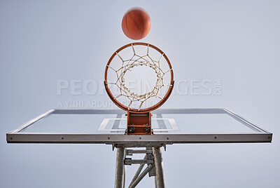 Basketball, shooting ball and target of outdoor sports goals, competition game and action on sky background. Background basketball court, air net and winning contest, training skill and performance