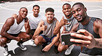 Selfie, basketball and sports with a team on a court taking a photograph after a game or training together. Phone, collaboration and fitness with a basketball player group posing for a picture
