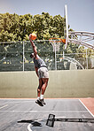Basketball dunk, sport and strong black man athlete on a outdoor basketball court with fitness. Sports person bus with cardio workout, exercise and training game feeling healthy, active and strong