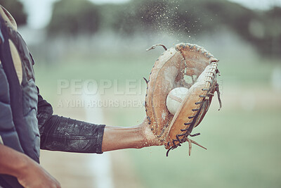 Buy stock photo Baseball, sports and catch with a man athlete catching a ball at a game on a field or grass pitch. Fitness, health and sport with a male baseball player playing a match at a sport venue for exercise