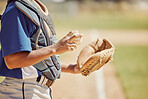 Baseball pitcher, sports and man athlete with ball and glove ready to throw at game or training. Fitness, exercise and professional male softball player practicing to pitch for match on outdoor field
