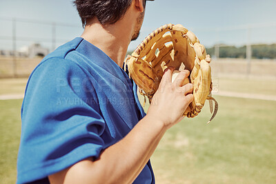 Buy stock photo Baseball, sports and man pitching during a game, training and professional event on a field. Back of athlete ready to throw a ball with a glove during an outdoor competition, fitness or cardio