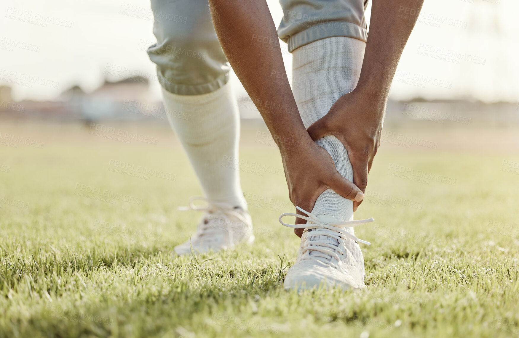 Buy stock photo Sports, field and man with ankle injury after game, competition or baseball performance workout. Emergency, training accident or athlete legs in pain after fitness, exercise or running on grass pitch