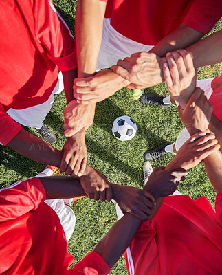 Buy stock photo Support, football and hands of team for sports on grass field for training, teamwork or collaboration. Fitness, workout or exercise with people in circle and soccer ball for goals, growth and friends