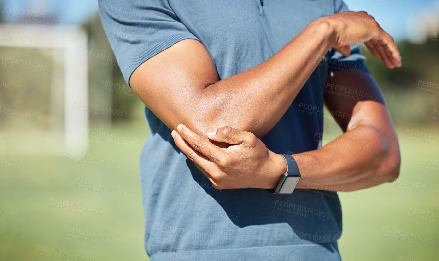 Buy stock photo Sports man with elbow pain on arm, injury in outdoor soccer field. Hand massage bone, person with emergency muscle problem, physiotherapy in sport and joint accident with physical therapy