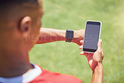 Buy stock photo Green screen, soccer player and phone on field with smartwatch, tech or mockup on mobile digital app. Man, football player or smartphone on social media, web or 5g network at training, game or match 