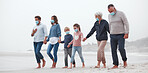 Big family, covid and holding hands walking on beach for quality bonding time together during pandemic in nature. Hand of parents, grandparents and kids in travel, freedom and family walk with masks