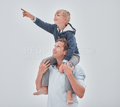 Buy stock photo Beach, dad and child on shoulders pointing, family holiday ocean walk in Australia. Travel, fun and happy father and son together, smile playing and walking at sea on vacation with cloudy gray sky.