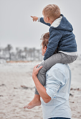Buy stock photo Travel, family and father with son at a beach, having fun while carrying child on shoulders and enjoying the view in Mexico. Parent, kid and hand of boy pointing to cloudy sky while on a sea vacation