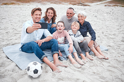 Buy stock photo Big family, phone selfie and beach holiday, vacation or trip outdoors. Grandparents, parents and children with soccer ball on sandy seashore, bonding and taking photo for happy memory or social media