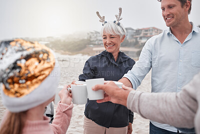 Buy stock photo Family, Christmas and holiday celebration on beach with drinks, smile and cheers. Happy man, senior woman and child celebrate spending time together on December ocean vacation drinking hot chocolate.