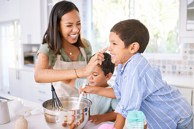 Buy stock photo Family baking and mother teaching children to bake cake in the kitchen of their home. Happy latino kids and woman play, cooking and laugh together while learning about food and being playful in home