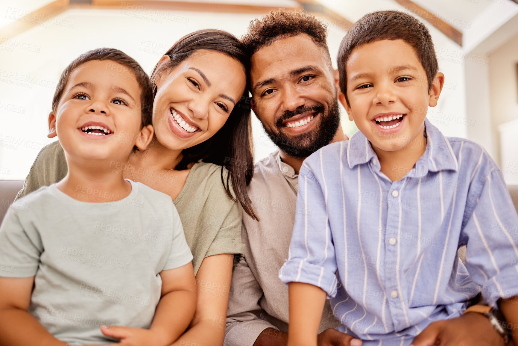 Buy stock photo Love, happy family and children relax on a sofa with parents, bonding and laughing in a living room together. Family, kids and portrait of man, woman and boys hugging on a couch, playful and cheerful