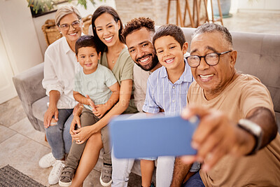 Buy stock photo Selfie, family and phone with grandfather taking a photograph of his grandchildren and their parents at home. Kids, photo and big family smile, happy and social media in living room with smartphone