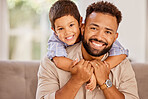 Family, portrait and father with son on a sofa, happy and relax in a living room together. Happy family, trust and love with child and parent hug, love and enjoy quality time in their home together