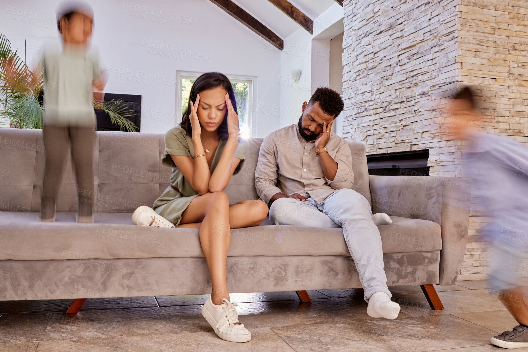 Buy stock photo Kids, stress and headache with a black couple in the living room of a house while crazy adhd children run around. Family, anxiety and depression with a mother, father and busy boy siblings at home