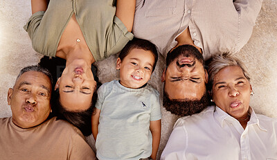 Buy stock photo Relax, portrait and happy family with funny faces or crazy facial expressions lying on a floor, top view. Grandparent, mother and father love freedom, bonding and enjoy quality time at home together