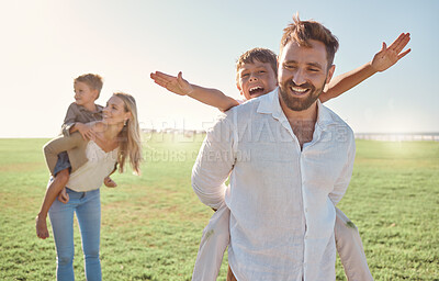 Buy stock photo Family, children and piggyback with parents carrying kids outdoor on a field during summer vacation. Happy, love and holiday with a girl, boy and parents on the back of mom and dad outside for fun