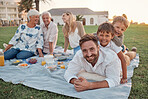 Picnic, father and children in a park to relax, calm and peace in Australia during summer. Portrait of dad and his kids playing, bonding and on holiday with lunch with grandparents and mom in nature