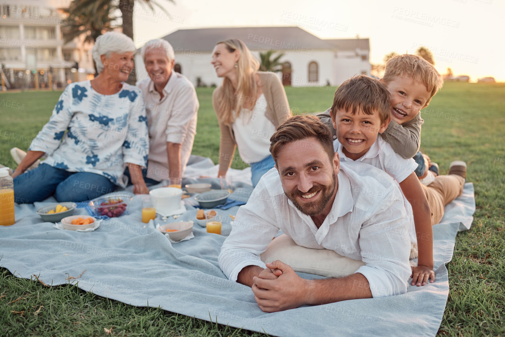 Buy stock photo Picnic, father and children in a park to relax, calm and peace in Australia during summer. Portrait of dad and his kids playing, bonding and on holiday with lunch with grandparents and mom in nature
