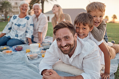 Buy stock photo Family picnic in garden, father with kids in outdoor park and healthy food for snack with grandparents support. Children playing with dad on grass, parents on weekend and big family vacation together