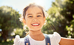 Summer, sunshine and portrait of Asian child in the park smile on face, playing and enjoying nature. Happiness, joy and young girl having fun outdoors on weekend, holiday and adventure on sunny day